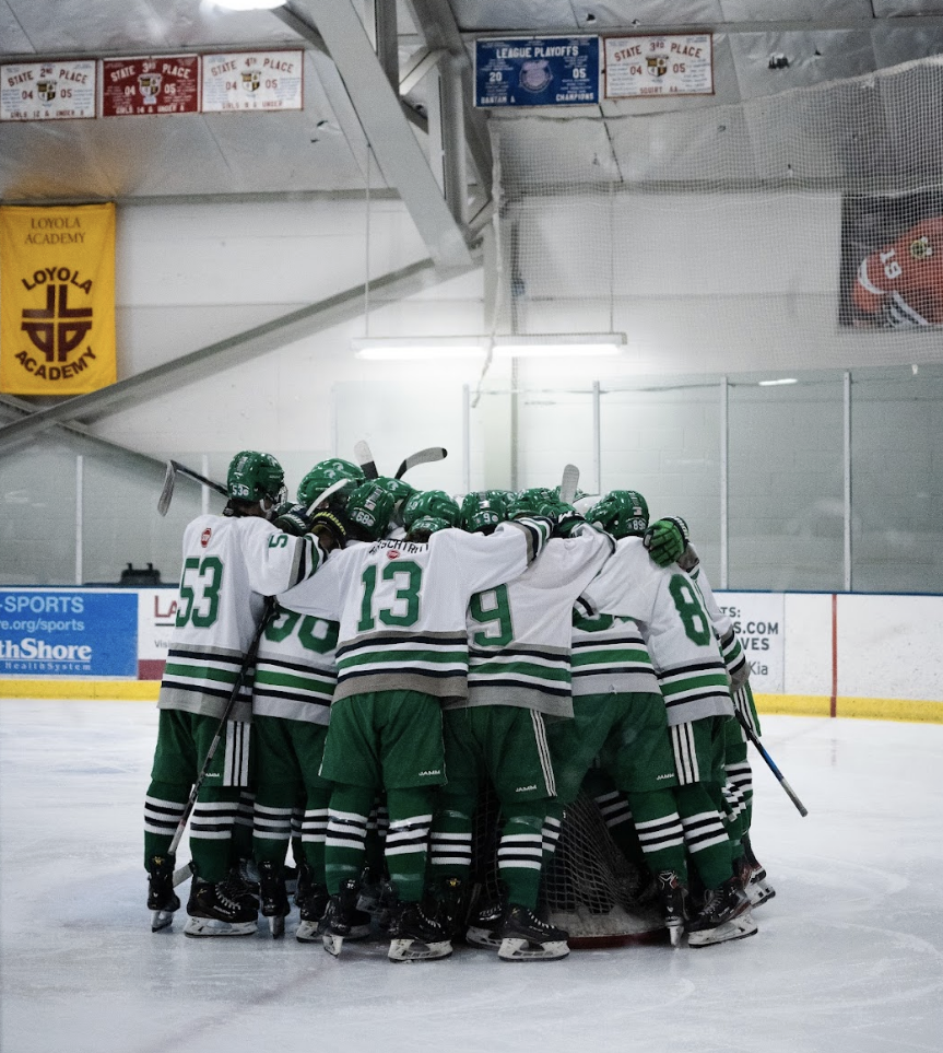 The team huddles up before a preseason win against Libertyville High School